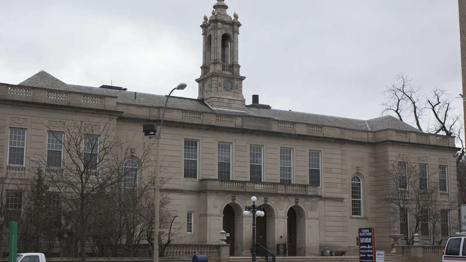 Stone Classical Revival town hall with a clock tower, Arlington, Massachusetts